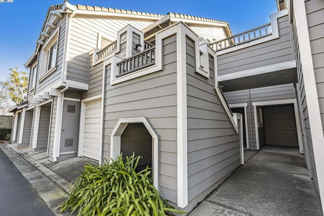 view of side of home featuring a garage