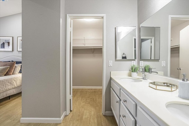 bathroom featuring vanity and hardwood / wood-style floors