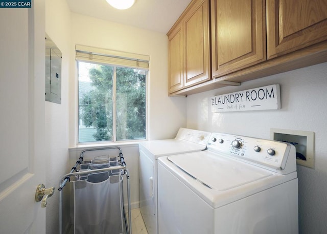 clothes washing area with cabinets, separate washer and dryer, a wealth of natural light, and electric panel