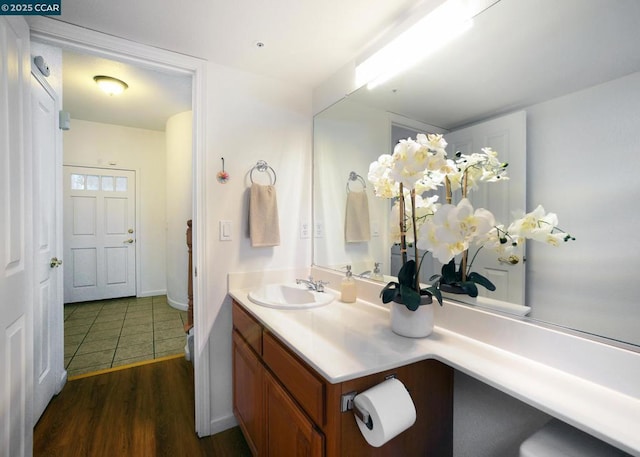 bathroom with hardwood / wood-style floors and vanity