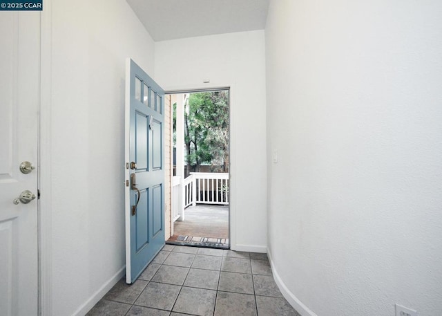 entryway featuring light tile patterned flooring