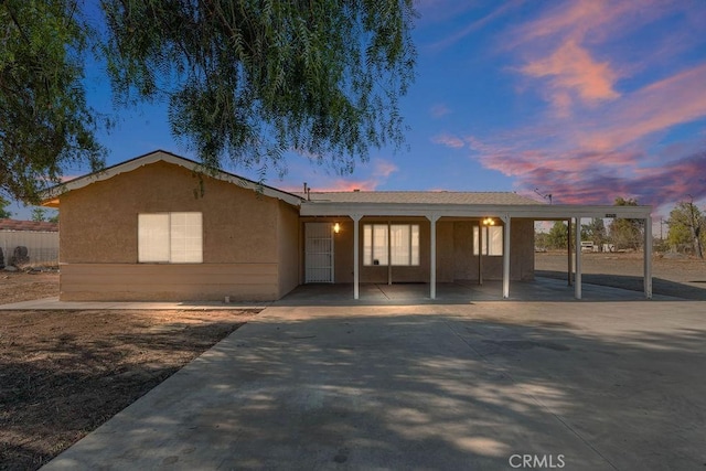 view of front of home with a carport