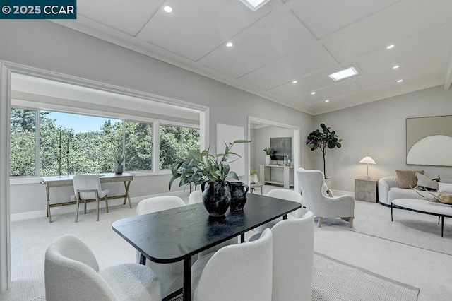 dining area featuring light colored carpet