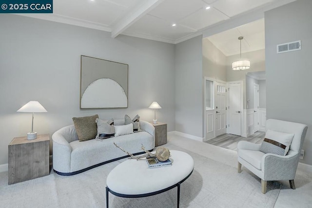 living room with beam ceiling, light wood-type flooring, and crown molding