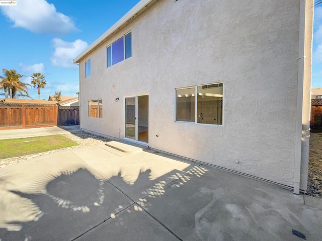 rear view of house featuring a patio