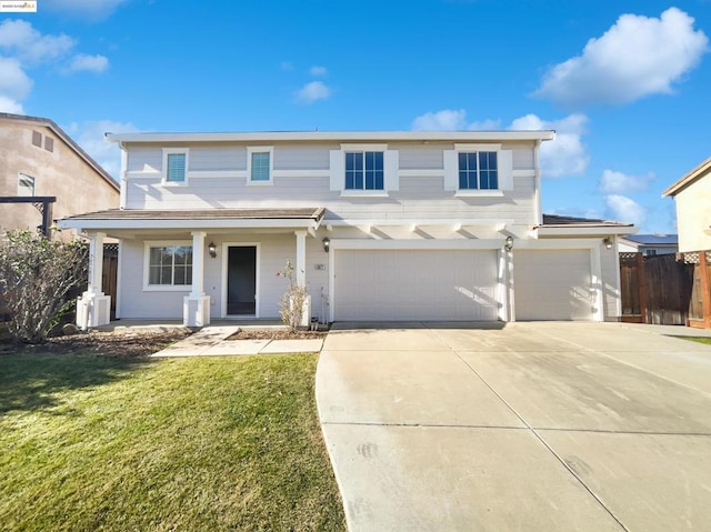 view of front of home featuring a front yard, covered porch, and a garage