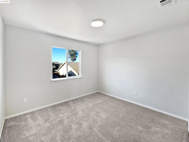 empty room with carpet flooring