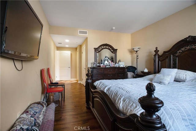 bedroom with dark wood-type flooring