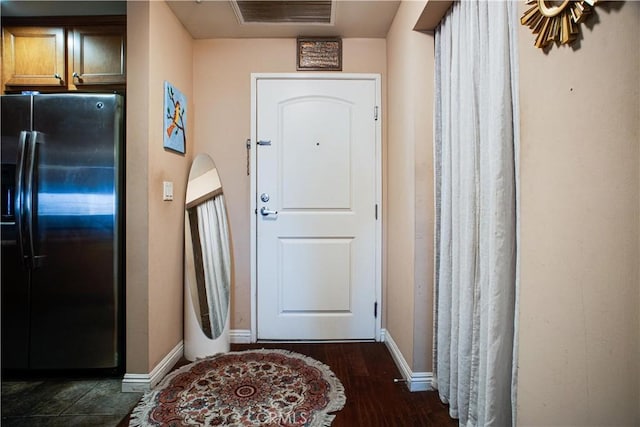 entryway with dark hardwood / wood-style floors