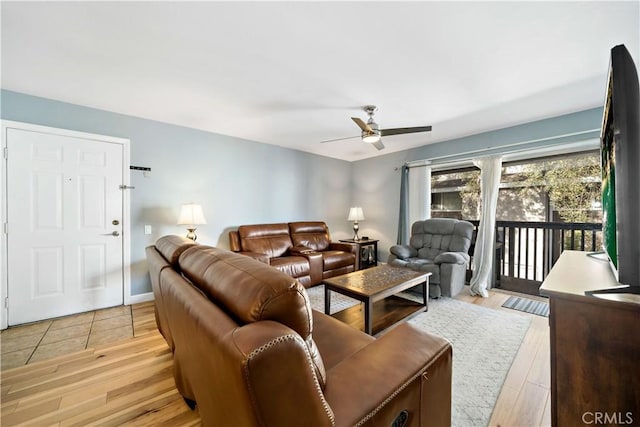 living room featuring ceiling fan and light wood-type flooring