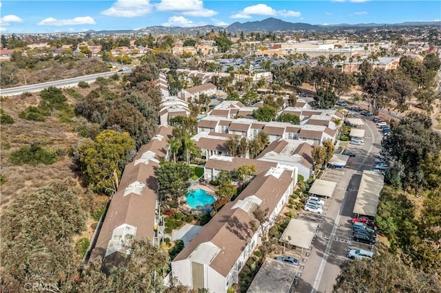 birds eye view of property with a mountain view