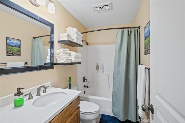 full bathroom featuring toilet, vanity, and shower / bathtub combination with curtain