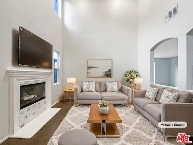 living room featuring a high ceiling