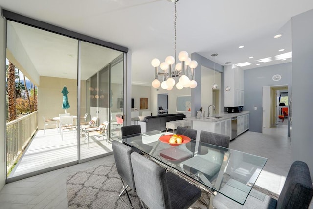 dining space featuring sink and a chandelier