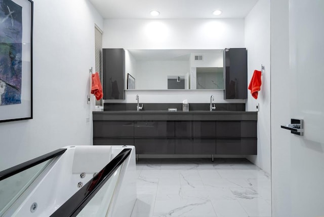 bathroom with vanity and a bathtub