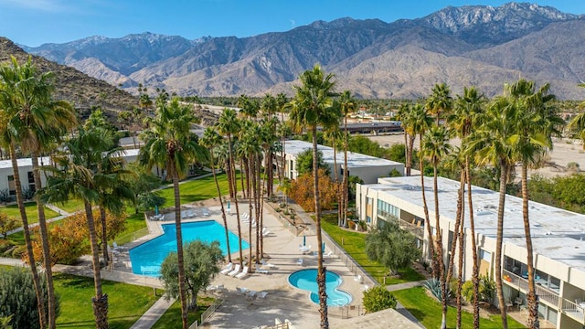 view of pool with a mountain view and a patio