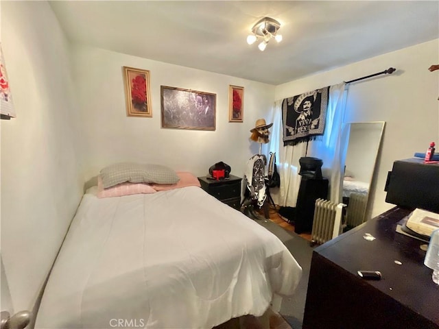 bedroom featuring radiator