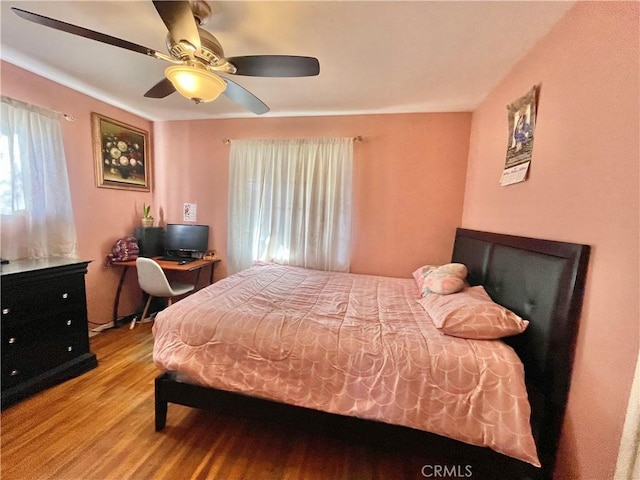 bedroom featuring ceiling fan and light wood-type flooring