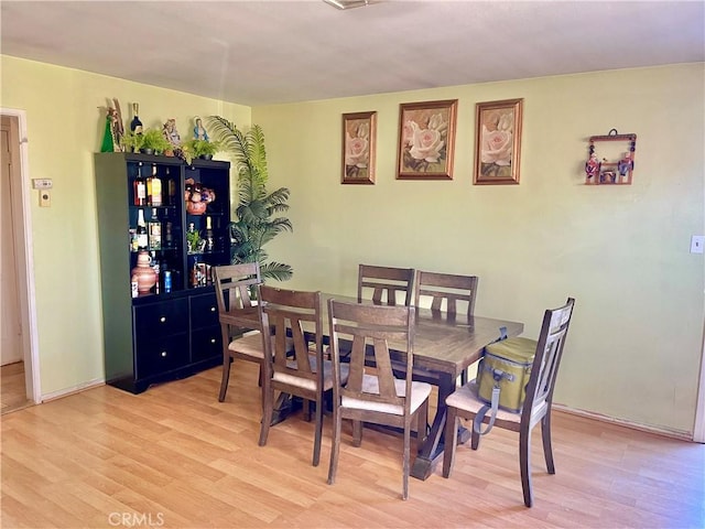 dining area featuring light hardwood / wood-style floors