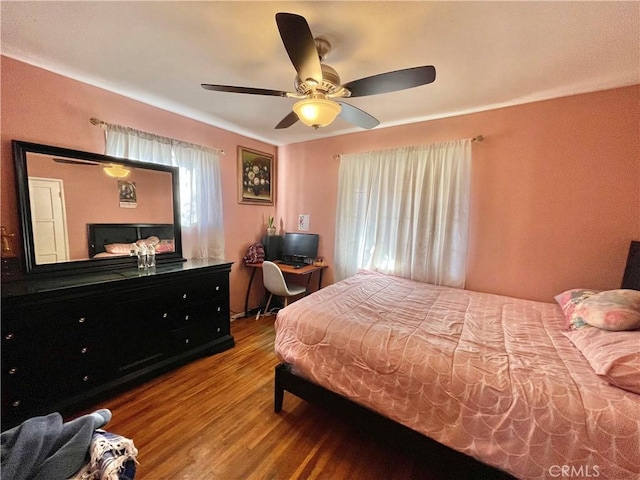 bedroom featuring ceiling fan and wood-type flooring