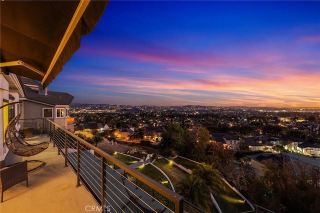 view of balcony at dusk