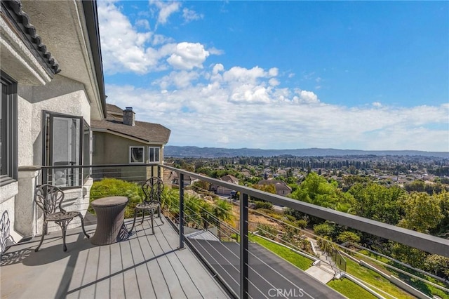 balcony featuring a mountain view