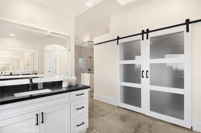 bathroom with concrete floors and vanity