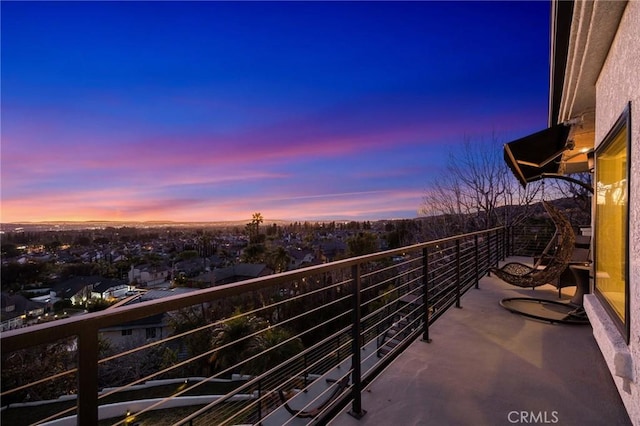 view of balcony at dusk