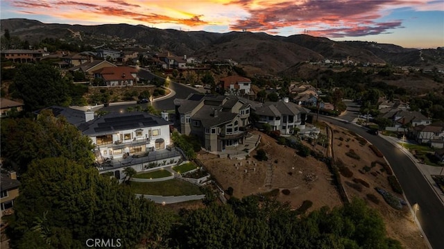 aerial view at dusk with a mountain view