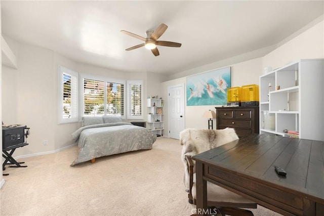 bedroom featuring ceiling fan and light colored carpet