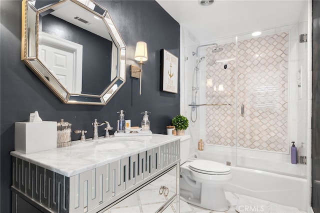 full bathroom featuring shower / bath combination with glass door, vanity, toilet, and tile patterned flooring