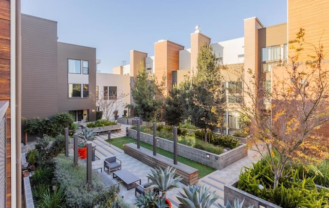 view of property's community with a patio area