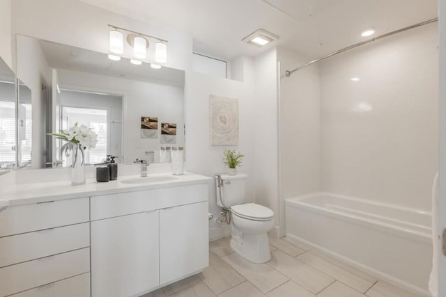 full bathroom featuring tile patterned floors, vanity, toilet, and shower / bath combination