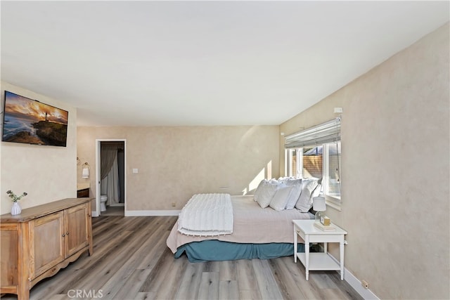 bedroom with wood-type flooring