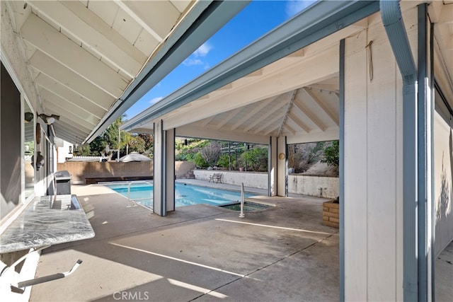 view of pool featuring a patio