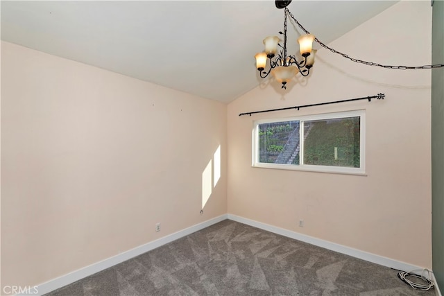 unfurnished room featuring carpet, a notable chandelier, and vaulted ceiling