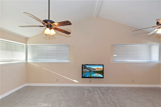 spare room featuring light carpet, ceiling fan, and lofted ceiling with beams