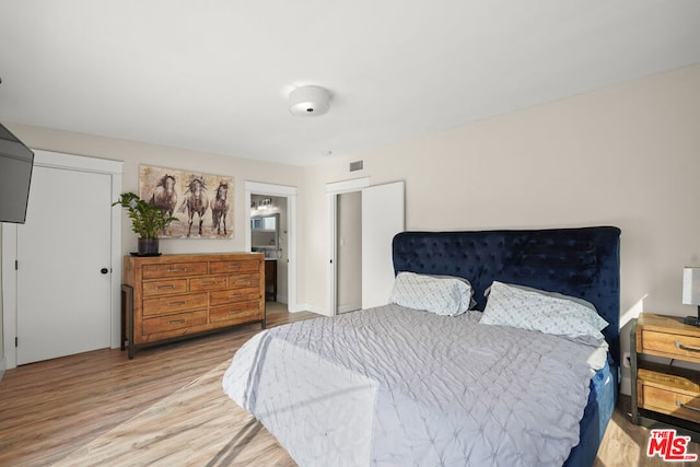 bedroom featuring light wood-type flooring