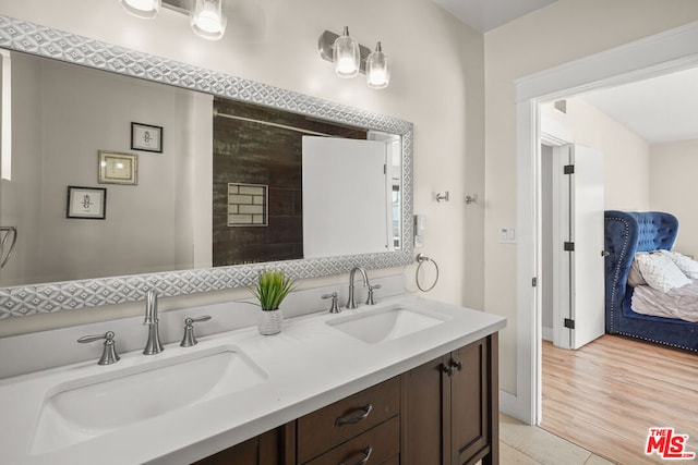 bathroom with vanity and hardwood / wood-style flooring