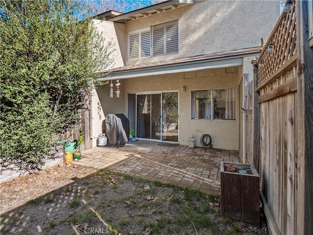 back of property featuring a patio