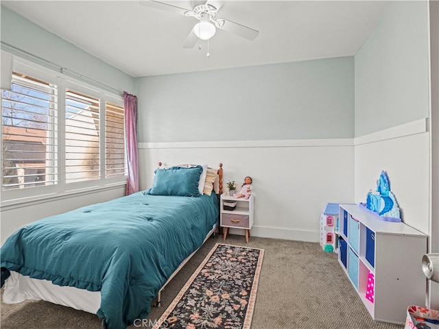 bedroom featuring ceiling fan and carpet flooring