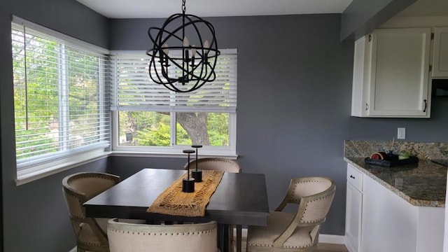 dining space with a notable chandelier