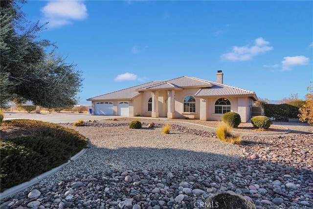 view of front of property with a garage