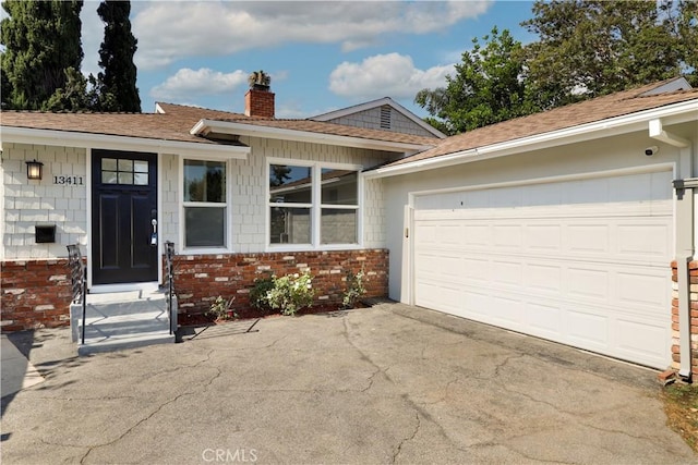 ranch-style house featuring a garage