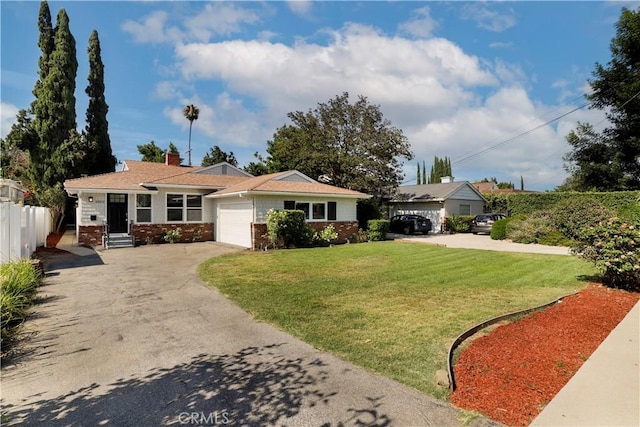 single story home featuring a garage and a front yard