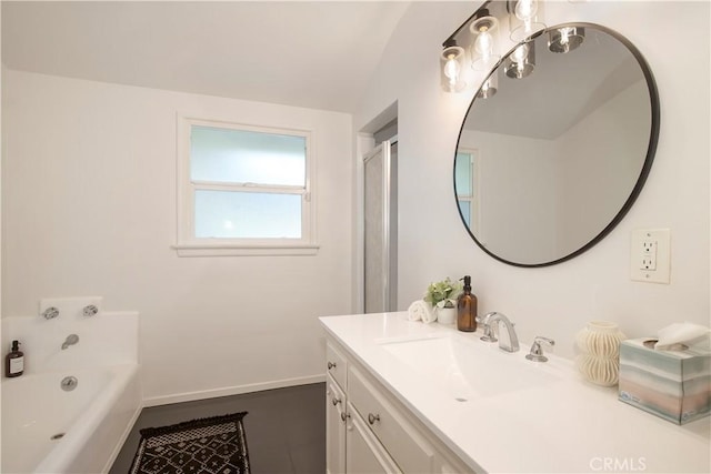 bathroom with a tub to relax in and vanity