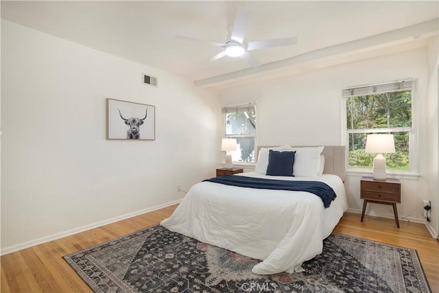 bedroom featuring ceiling fan and hardwood / wood-style flooring