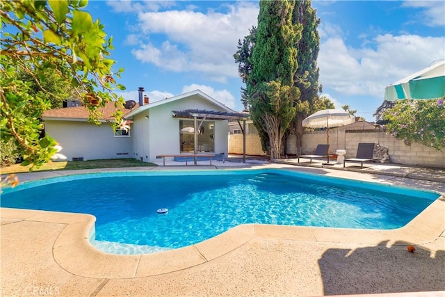 view of swimming pool featuring a pergola and a patio