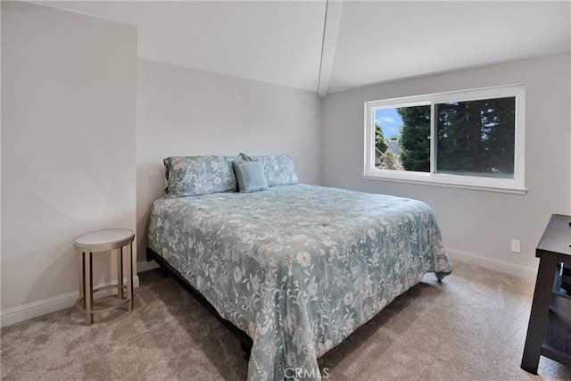 bedroom featuring vaulted ceiling and carpet floors