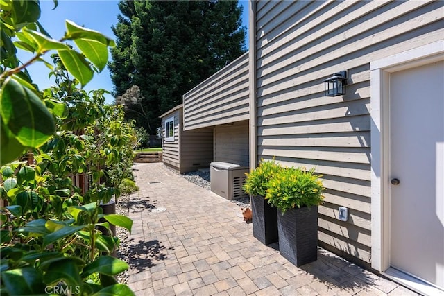 view of property exterior with a patio